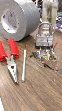 Some small bits and pieces, tools, materials, etc on the sudo room table
